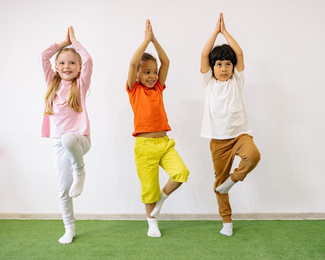 Children in a yoga pose